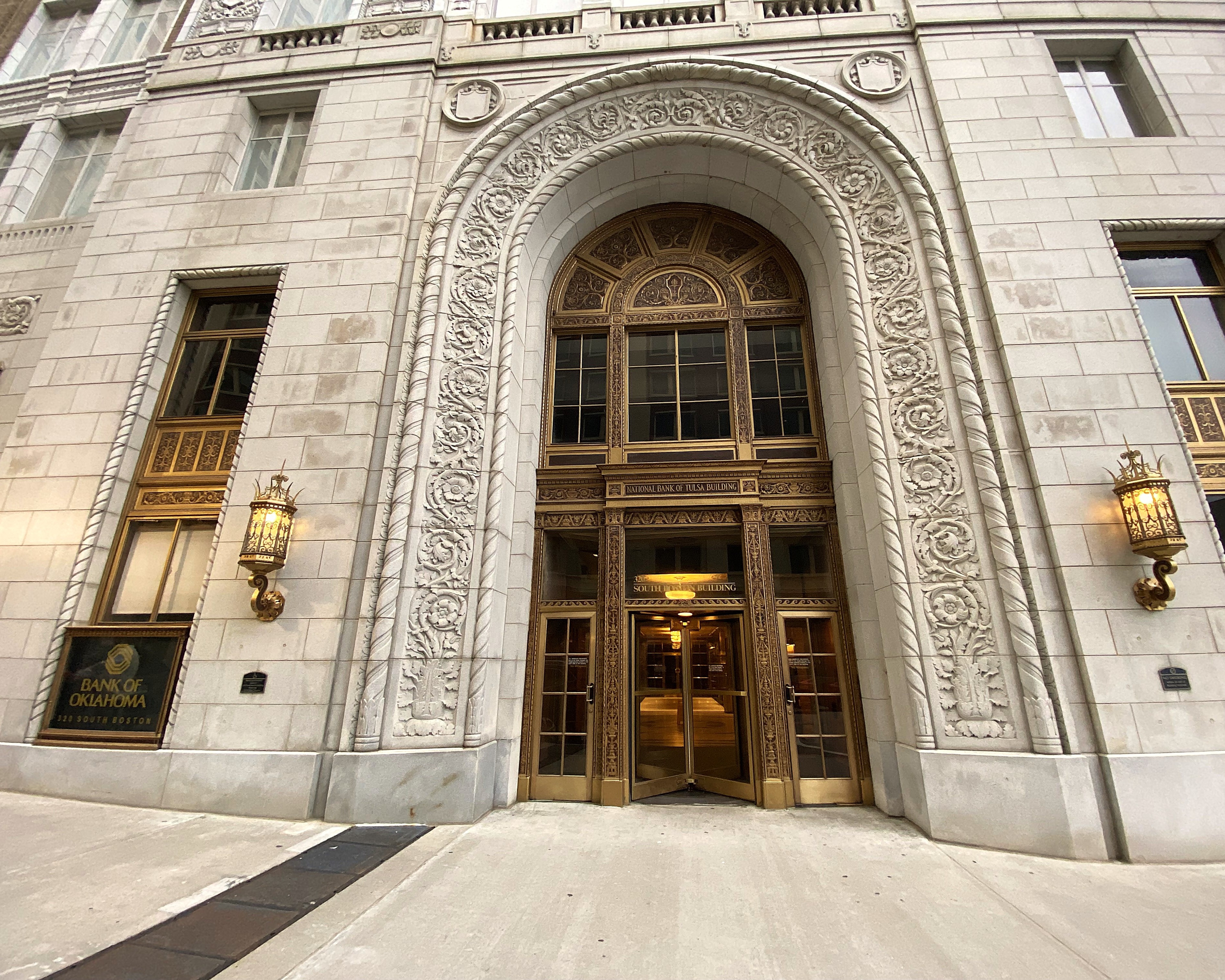 Brass arched entrance of the 320 South Boston Building in downtown Tulsa
